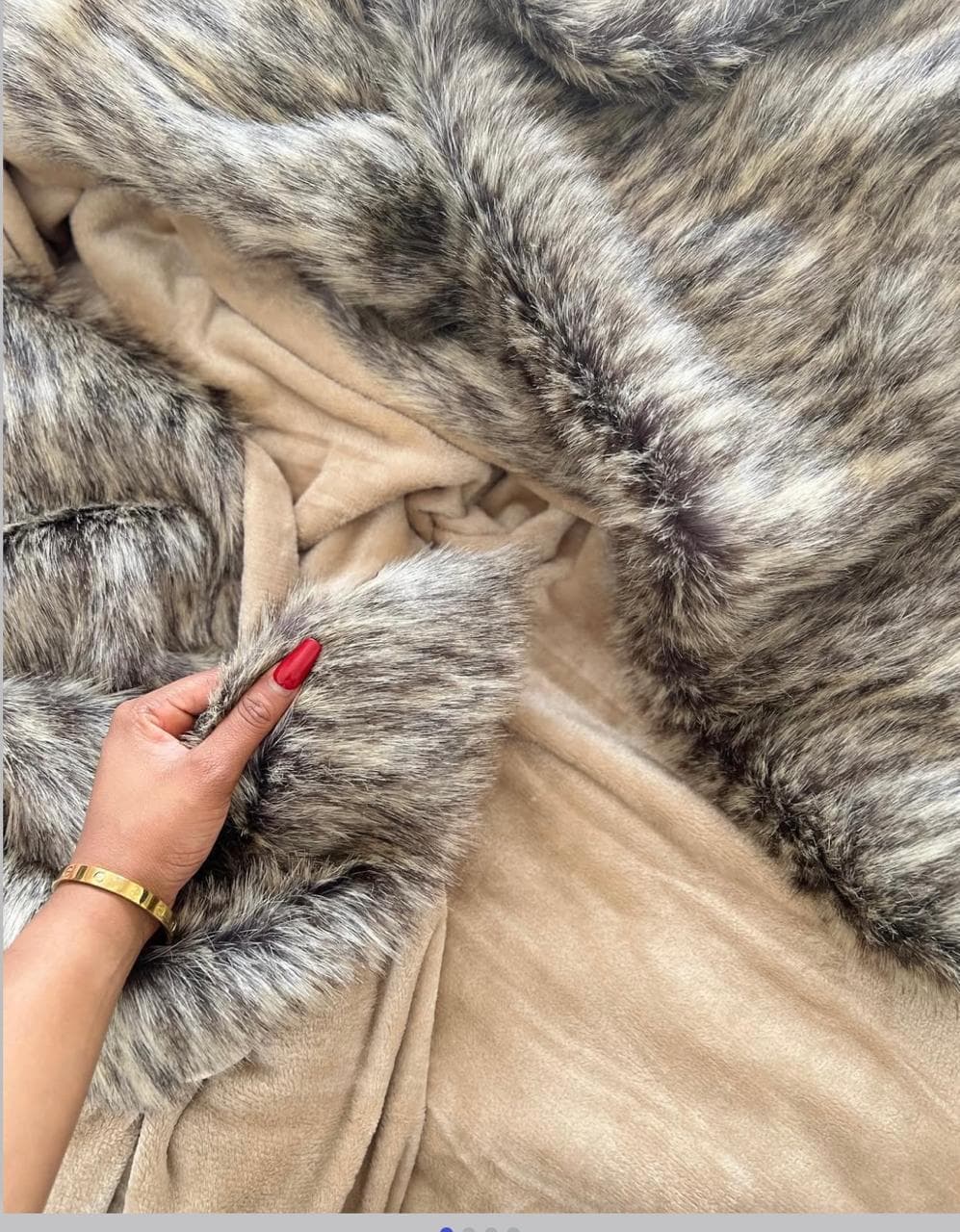 Brown fur blanket showing lining